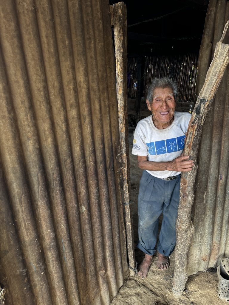 A village elder at the door of his home