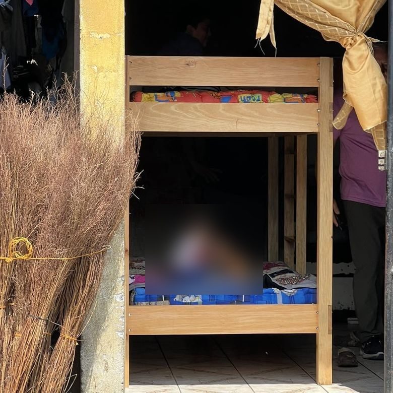 Two children in their new bunk bed