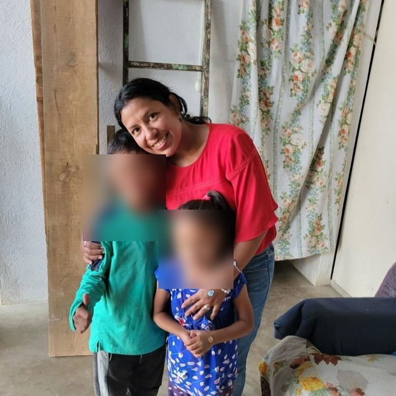 A mother and her children at home