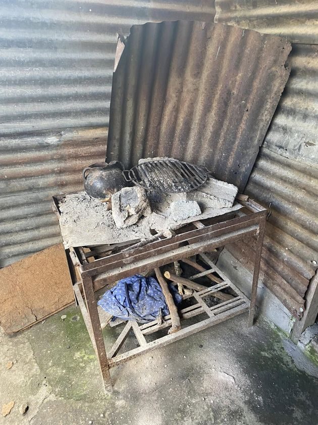 The old, worn cooking stove a family uses now