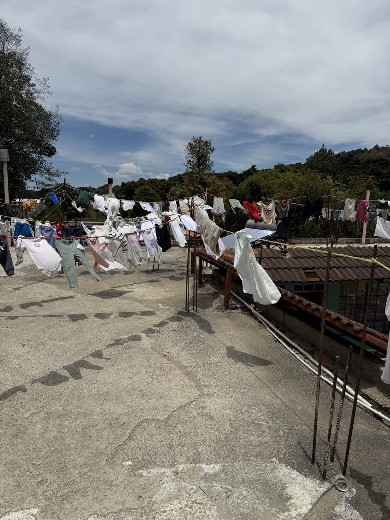 Laundry drying above a highland village